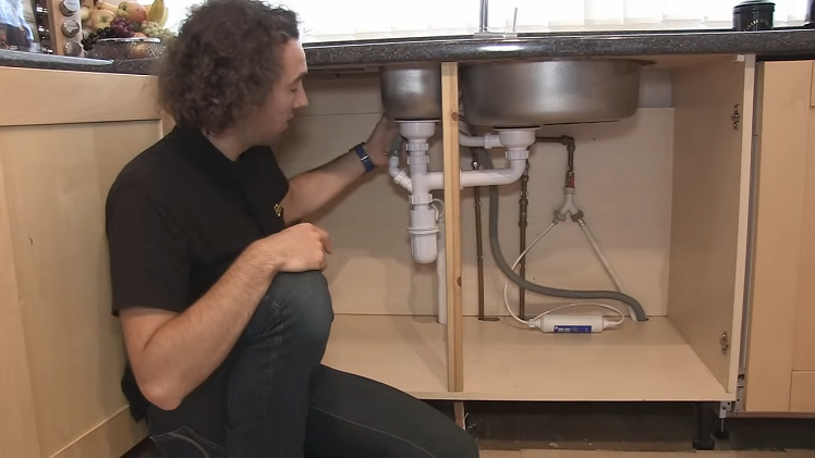 Positioning The Drain Hose As High As Possible Inside The Sink Cupboard