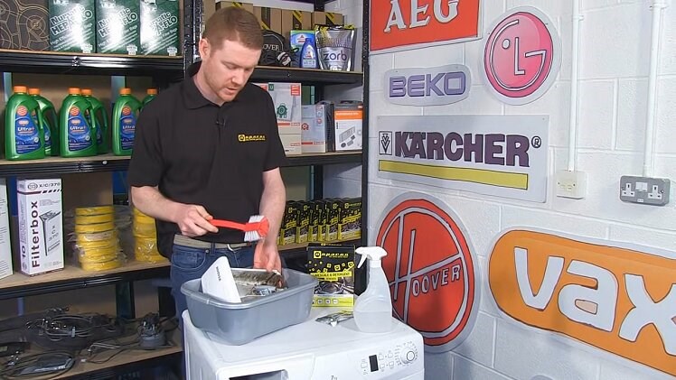 Removing Mould From The Washing Machine Detergent Drawer With A Brush