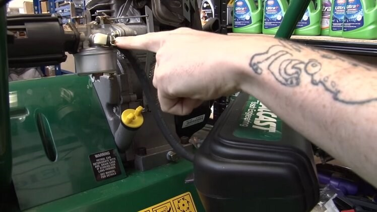 Lower the fuel tank so that it's lower than the end of the fuel line