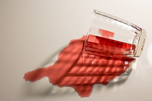 Red Liquid Spilling From Glass