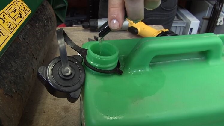Place the end of the fuel line into a jerry can and drain out the fuel 