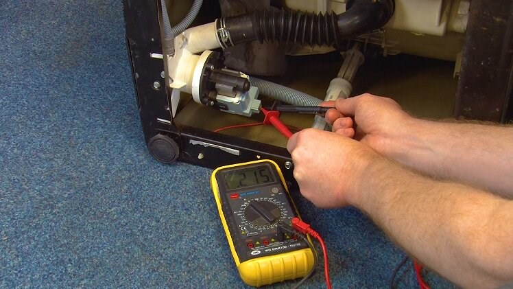 Place the two multimeter prongs into the socket in which the electrical connection was connected to on the drain pump