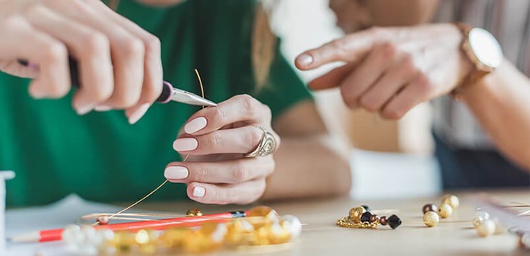 Someone making some jewellery 