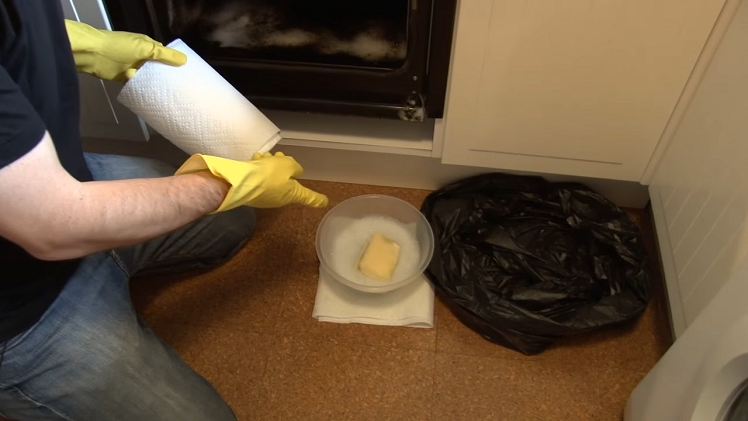 A Bowl Of Warm Soapy Water, A Scouring Sponge, A Bin Liner And Kitchen Roll Ready At Hand