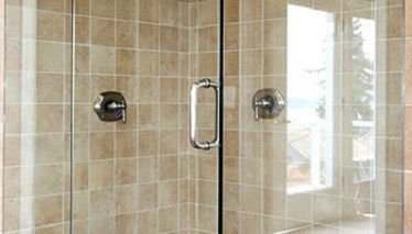 Shiny shower glass with a window vacuum