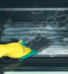 Cleaning The Inside Oven Walls With A Sponge