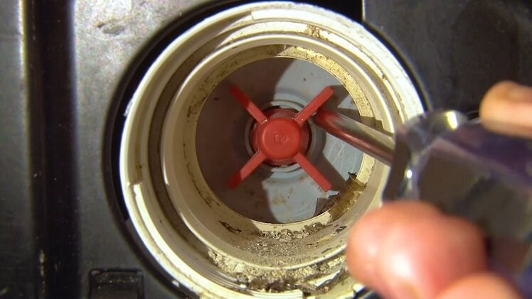 Use a screwdriver to check that the impeller inside the filter's housing isn't blocked or obstructed