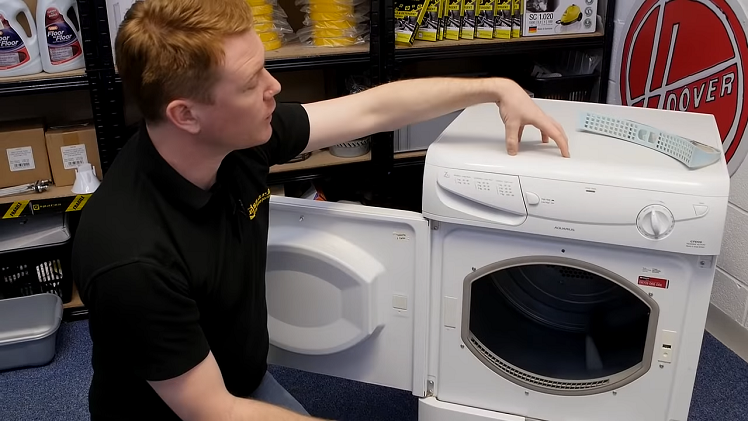 Removing The Tumble Dryer's Lid And Checking The Inside Of The Cabinet For Any Fluff Or Lint