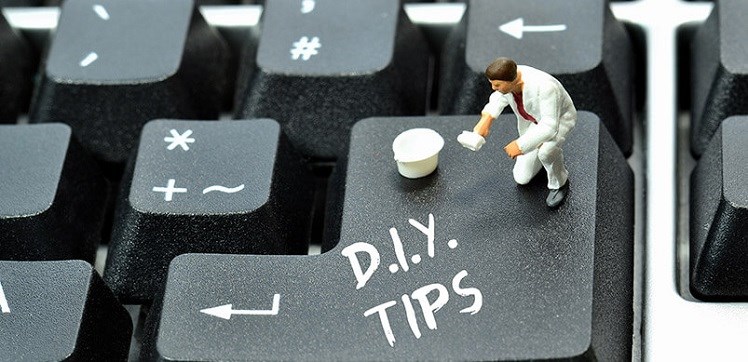 Close Up of a Tiny Man Painting a Keyboard