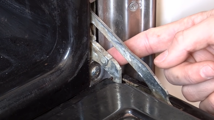 The Double Lever Hinge Mechanism On Either Side Of The Oven