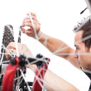 Man fixing bicycle chain