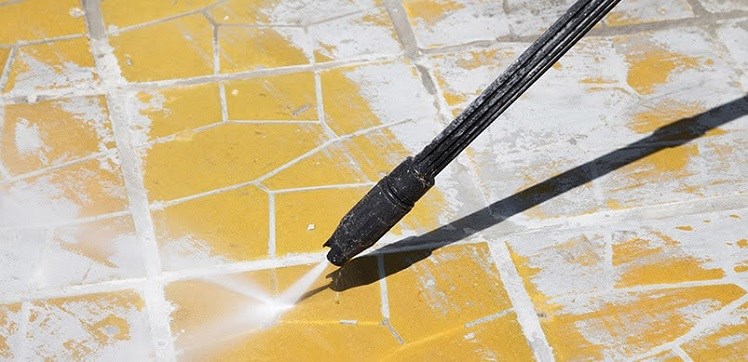 Pressure Washer Cleaning Yellow Floor Tiles