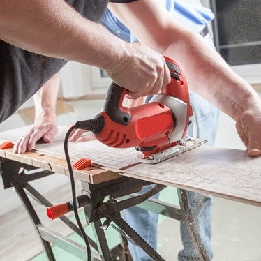 Man sawing wood