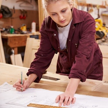 Woman drawing out plans