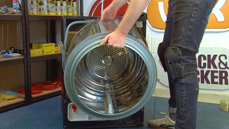 Carefully Lifting Out The Tumble Dryer Drum