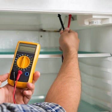 Seek out the symptoms - man fixing fridge