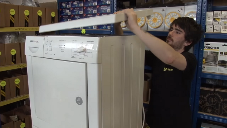 Unscrewing And Removing The Tumble Dryer's Top Panel
