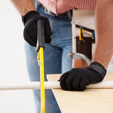 Man securing a length of pipe