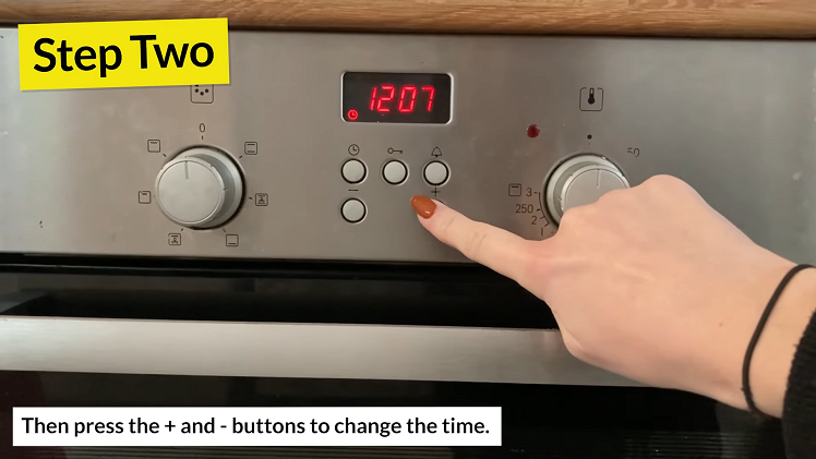 To change the time, simply press the + and - buttons beneath the clock.