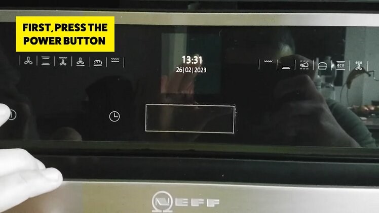 Press the power button to the left side of the digital display to access the clock setting