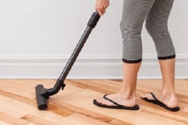 Woman vacuuming - not vacuuming beforehand