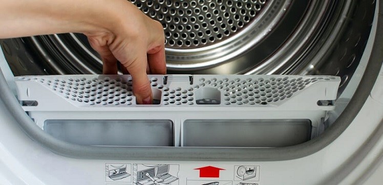 Hand Removing Tumble Dryer Filter