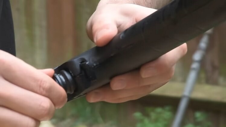 The Other End Of The Hose Plugs Into The Handgun