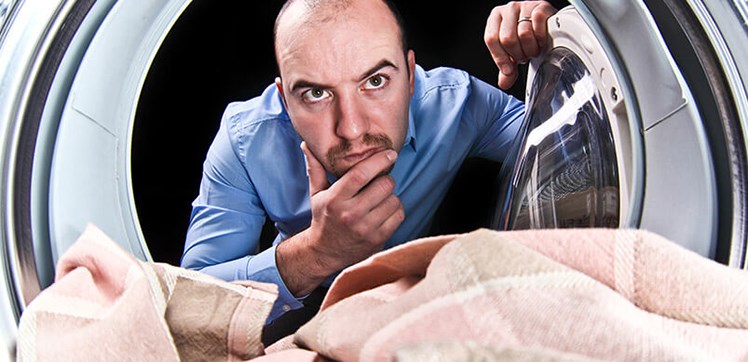 Person looking into washing machine drum