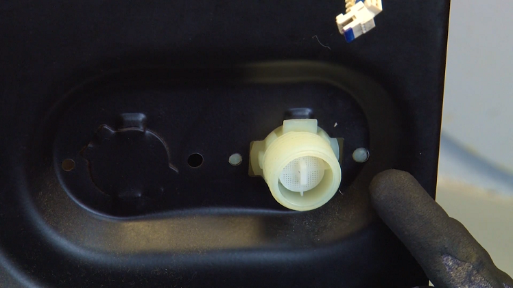 From the outside, you can see the two locking tabs slot into place, signifying that the new valve is secure