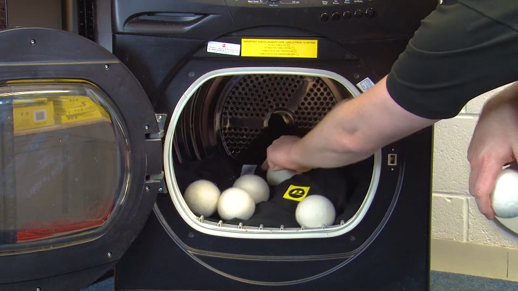 Place the appropriate amount of balls inside your tumble dryer with your laundry