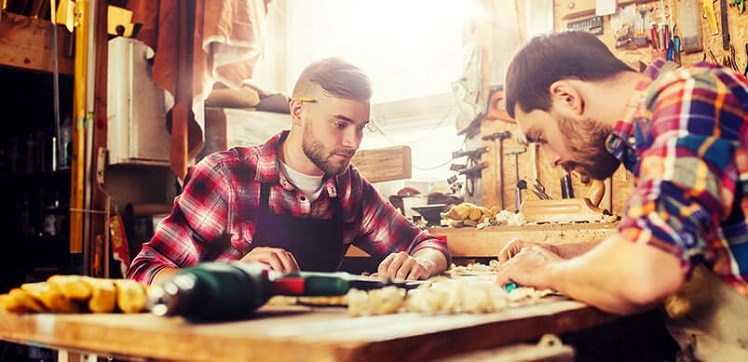 Two Young Men Doing Woodwork Together