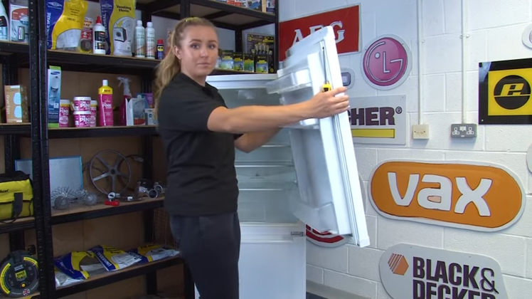 Lifting Off The Fridge Door From The Centre Hinge