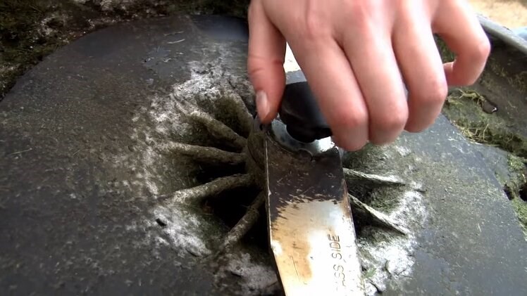 Fully remove the knob that holds the blade and impeller in place by unscrewing it by hand