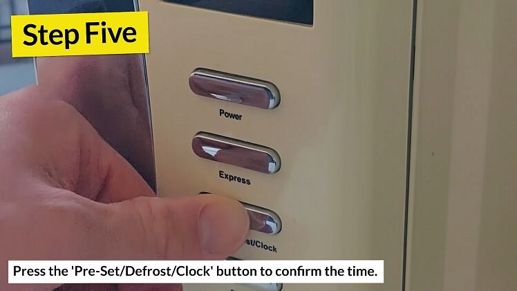 Confirm the minutes by pressing the button labelled 'Pre-Set/Defrost/Clock' once more
