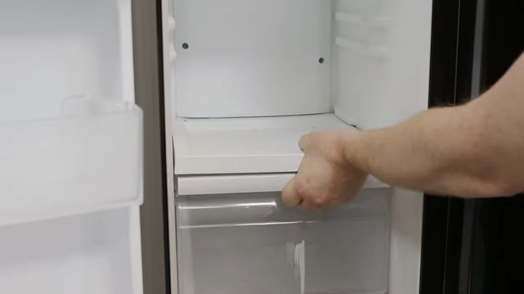 Removing Everything From Inside The Freezer Cabinet Such As Drawers And Shelves