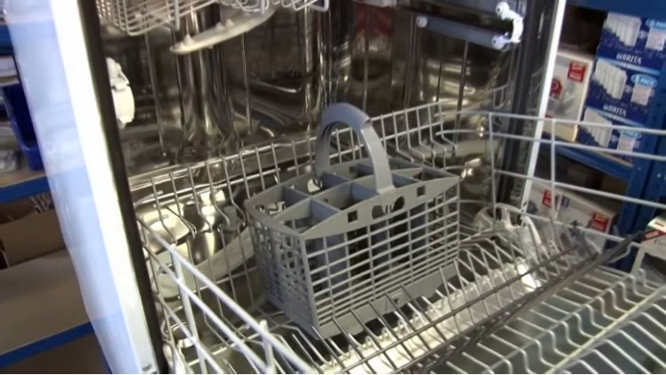 A Cutlery Basket Placed On The Dishwasher Basket