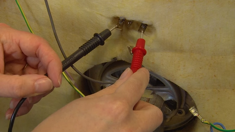 Test the faulty heating element using your multimeter's probes against the two tabs protruding from the element