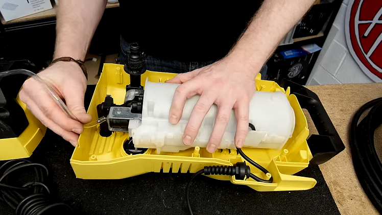 Removing The Pressure Washer Detergent Hose From The End Of The Motor Assembly