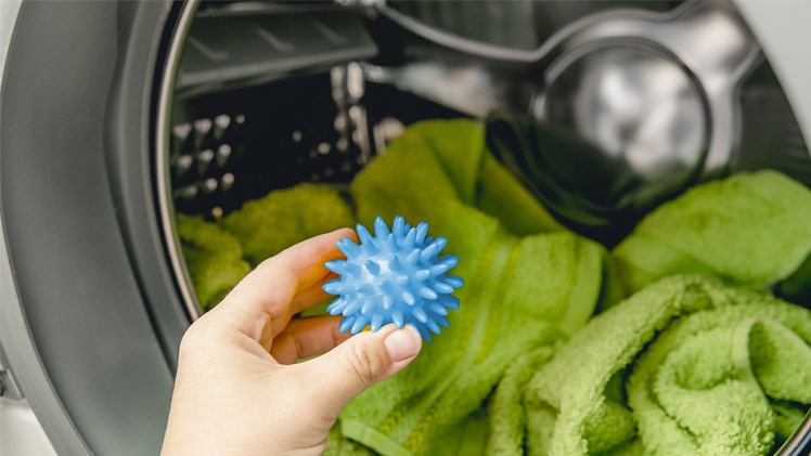 A Energy Saving Tumble Dryer Ball Going Into The Tumble Dryer