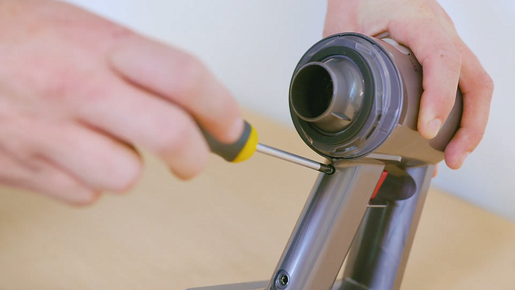 Use your Phillips screwdriver to remove the screw from the back of the handle.
