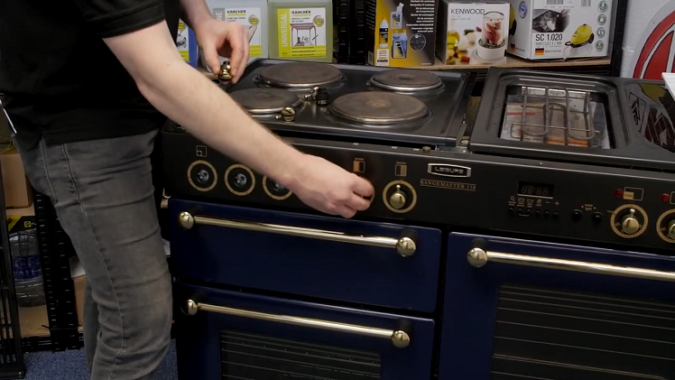 Removing The Control Knobs By Hand From The Front Panel Of The Cooker