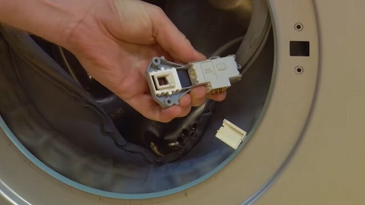 Pull the electrical connection off the door lock to completely remove it from the washing machine