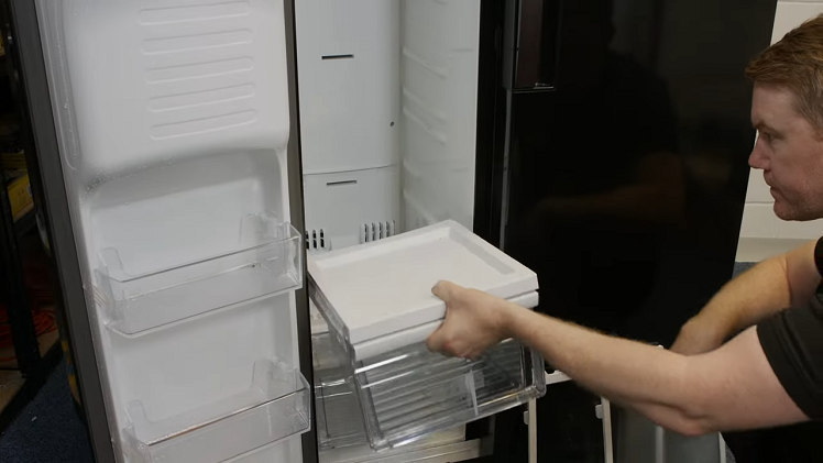 Refitting The Furniture Inside The Freezer Such As The Drawers And Shelves