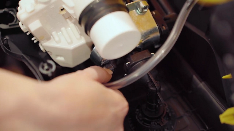 Returning to the soap dispenser hose, you will need to pull off the end that's connected to the small soap feed pipe.