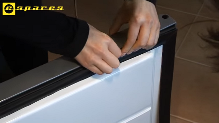 Starting At One Top Corner, Pressing The New Door Seal Firmly Into Place All The Way Along The Top Until It Reaches The Other Corner
