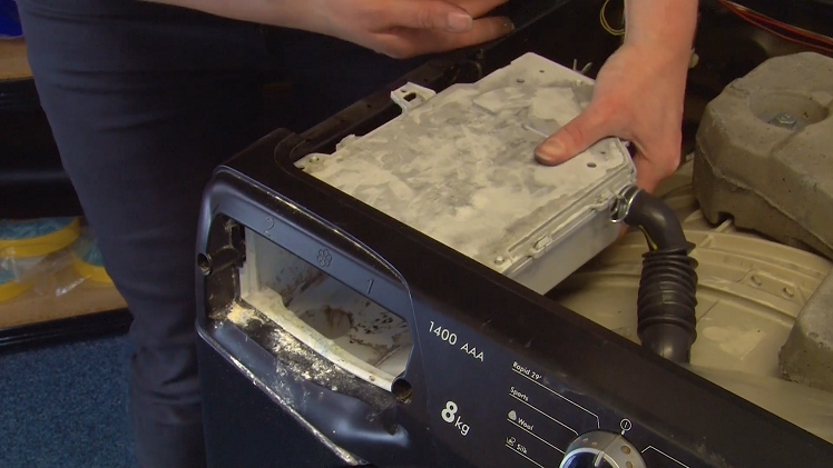 Refit the soap drawer housing into place against the inside of the soap drawer opening.