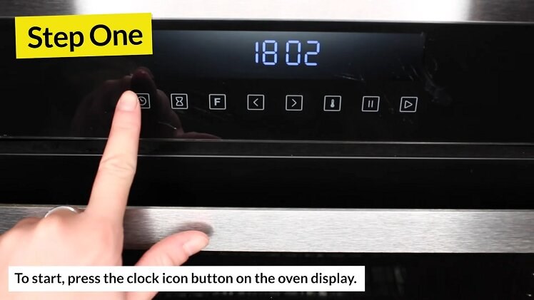 Press the clock icon button on the front oven display