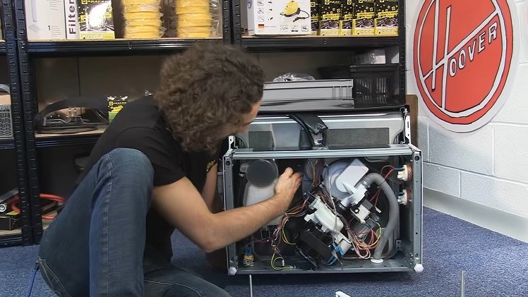 Checking The Drain Pump And Hoses Inside The Dishwasher For Any Leaks