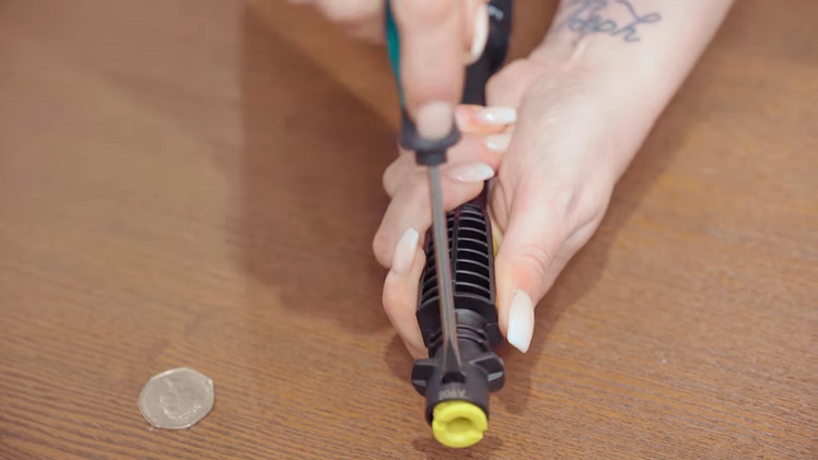 Once unscrewed, use a flatblade screwdriver to pry the stopper out of the tool.