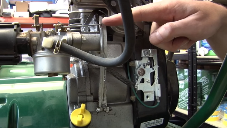 When The Petrol Lawnmower Throttle Is Engaged, It Opens The Carburettor